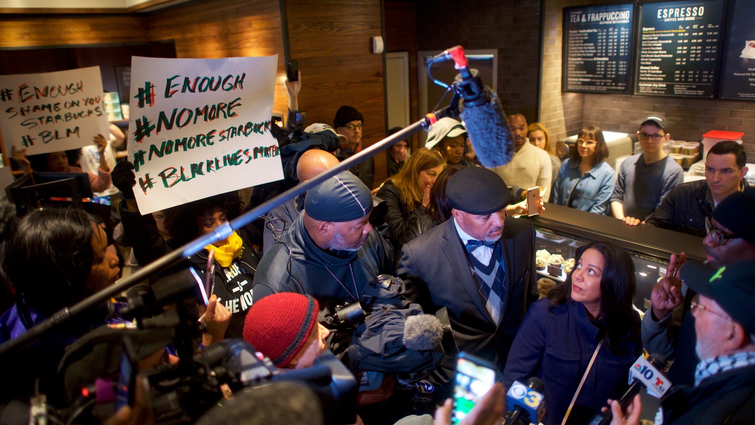 Starbucks Mid-Atlantic Regional Vice President Camille Hymes, center, addresses media and protestors in the Center City Starbucks in Philadelphia on April 15, 2018, after police arrested two black men who were waiting inside the location. (Credit: Mark Makela / Getty Images)