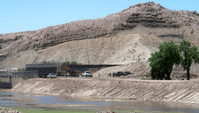 Construction crews are seen working in an area of the U.S.-Mexico border near the New Mexico-Texas state line, in an image taken from CNN video.