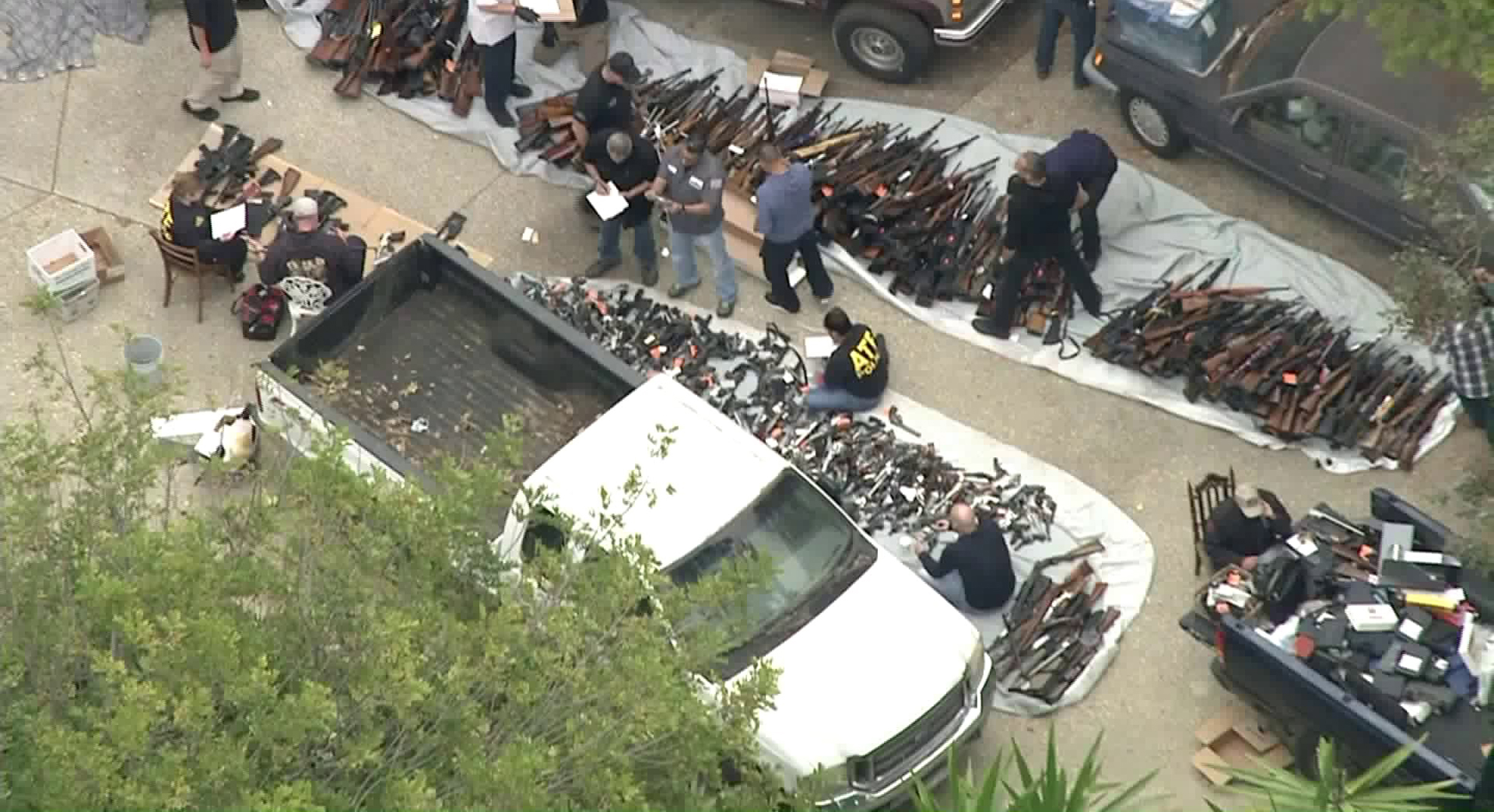 ATF officials investigate after hundreds of guns are found in a Bel-Air home on May 8, 2019. (Credit: KTLA)