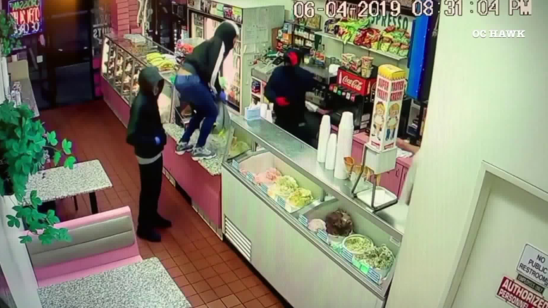 Three robbers are seen on surveillance video at Randy Donut in Norwalk on June 4, 2019.