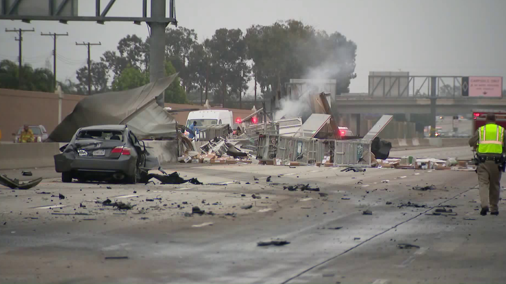 Debris from a fiery crash lie scattered on the eastbound State Route 22 in Garden Grove on June 9, 2019. (Credit: KTLA)