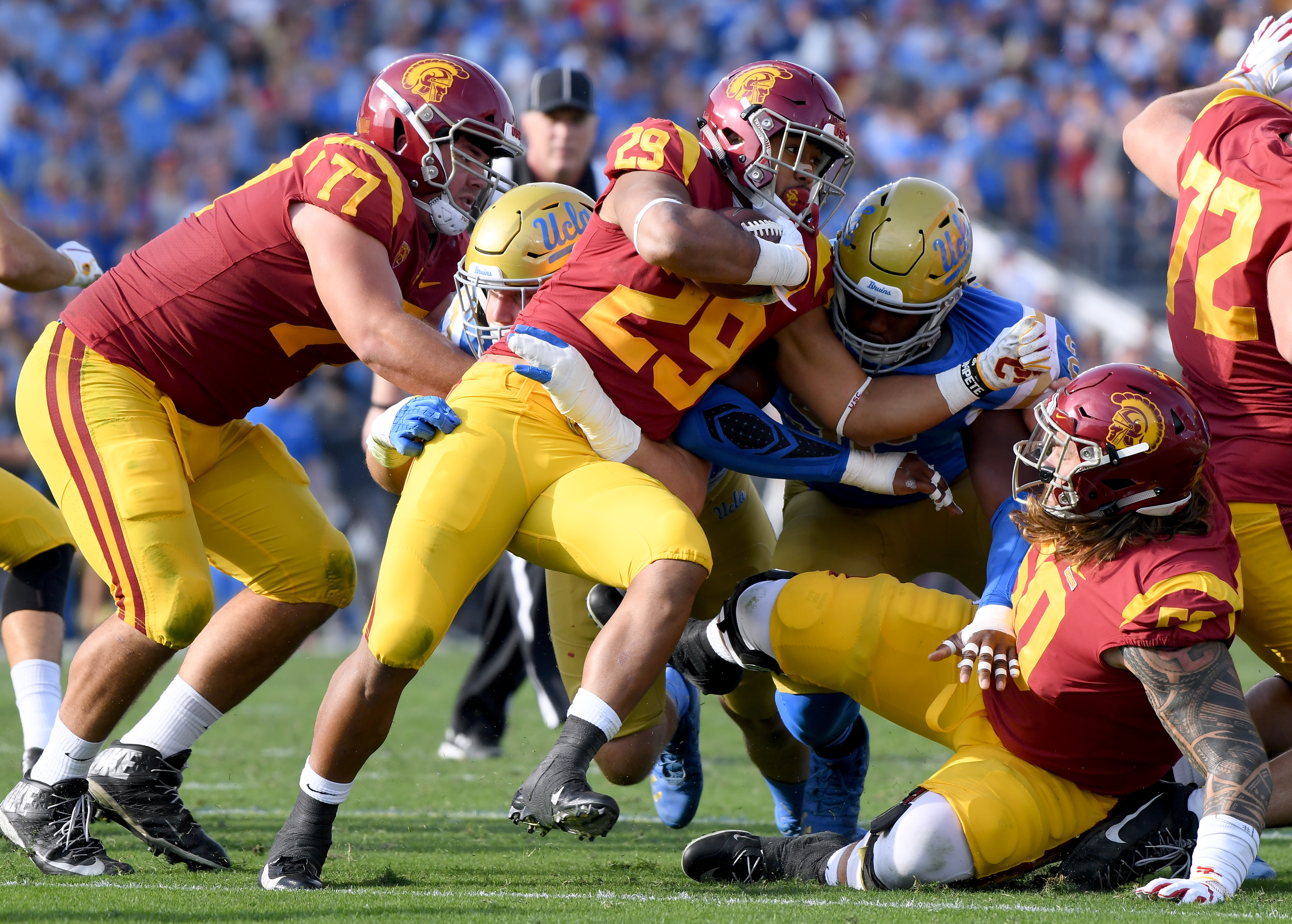 Players from the USC Trojans and the UCLA Bruins play football at the Rose Bowl on Nov. 17, 2018, in Pasadena. (Harry How/Getty Images)