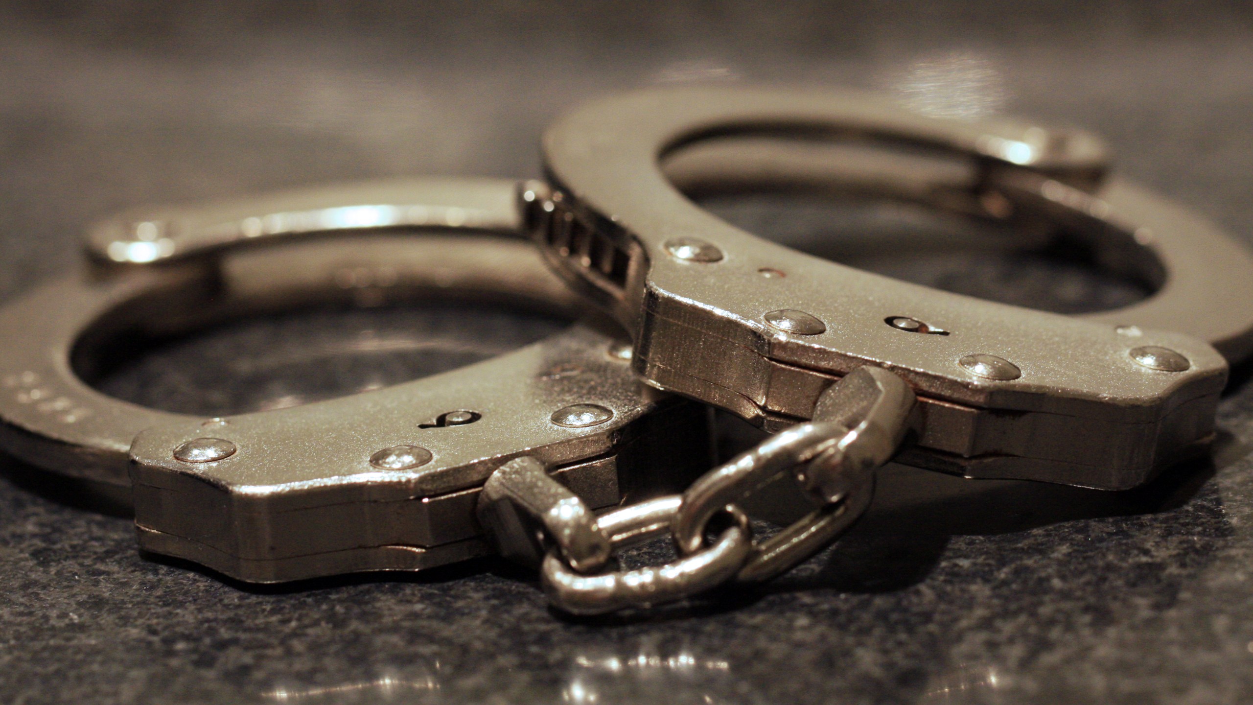 Handcuffs sit on a table in this file photo. (Credit: Getty Images)