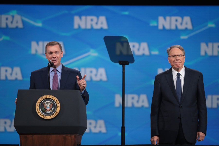 Chris Cox (L), executive director of the NRA-ILA, and Wayne LaPierre, NRA vice president and CEO, speak to guests at the NRA-ILA Leadership Forum at the 148th NRA Annual Meetings & Exhibits on April 26, 2019 in Indianapolis, Indiana. (Credit: Scott Olson/Getty Images)