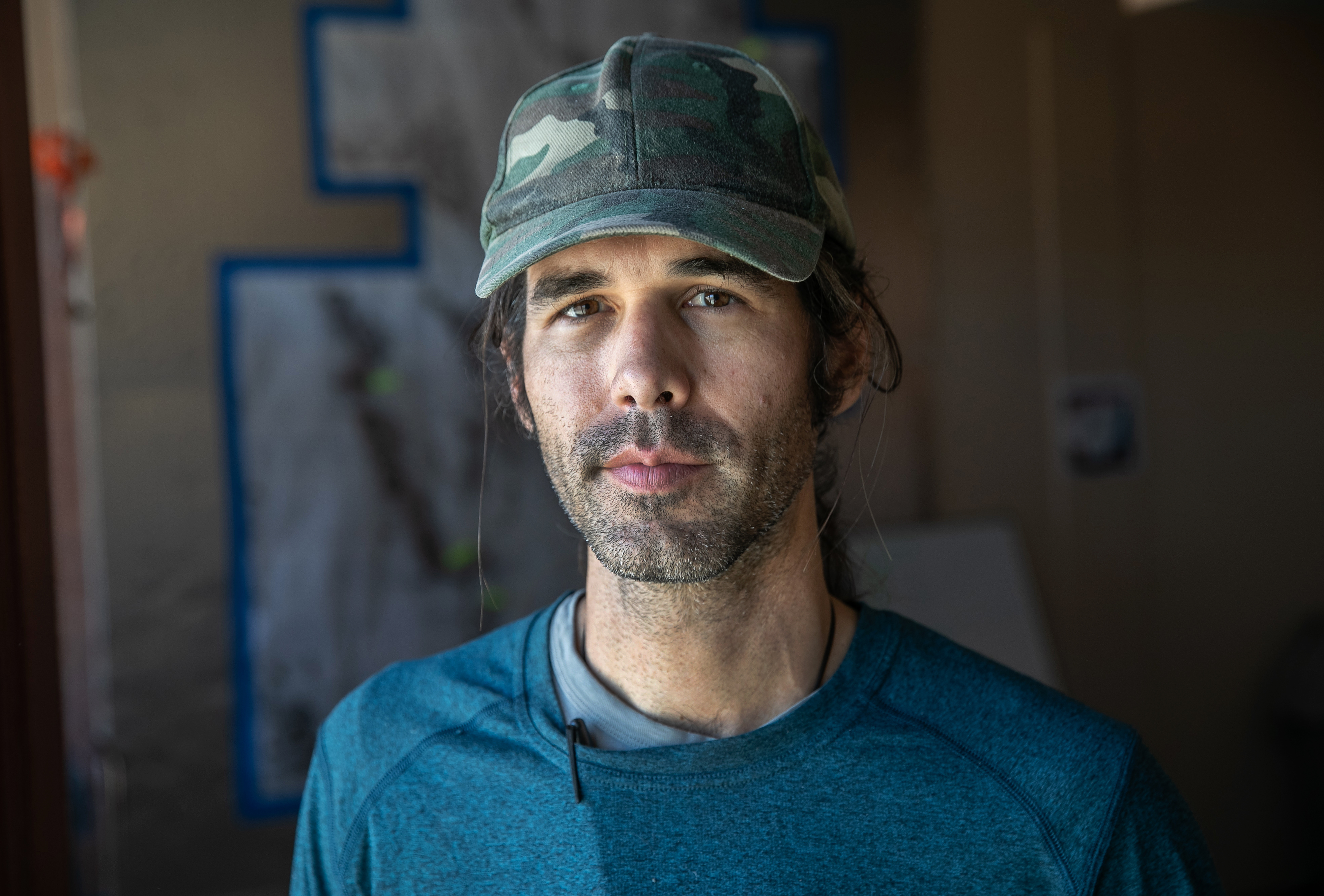 Scott Warren, a volunteer for the humanitarian aid group No More Deaths stands in the group's office on May 11, 2019, in Ajo, Arizona. (Credit: John Moore/Getty Images)