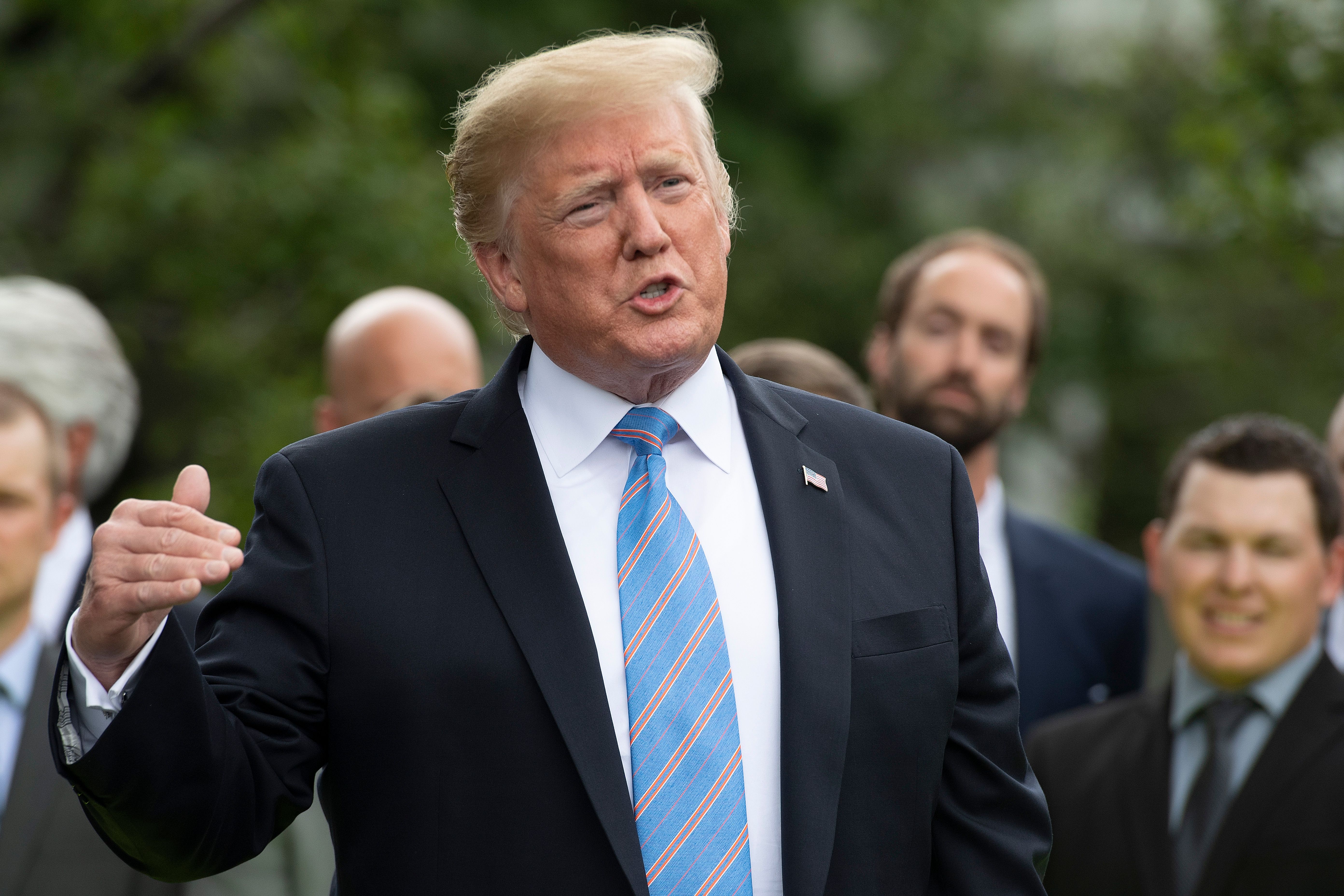 US President Donald Trump gives remarks after receiving a helmet from French race car driver and Indianapolis 500 winner Simon Pagenaud at the White House in Washington, DC, on June 10, 2019. (Credit: JIM WATSON/AFP/Getty Images)