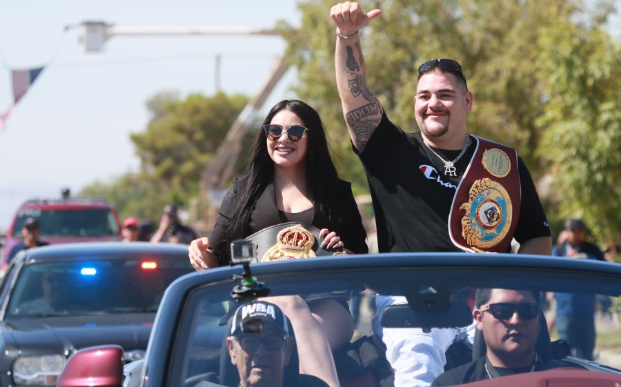 Heavyweight boxing champion Andy Ruiz Jr. and his wife Julie Ruiz wave to supporters during a parade in his honor on Saturday, June 22, 2019 in Imperial. (Credit: SANDY HUFFAKER/AFP/Getty Images)