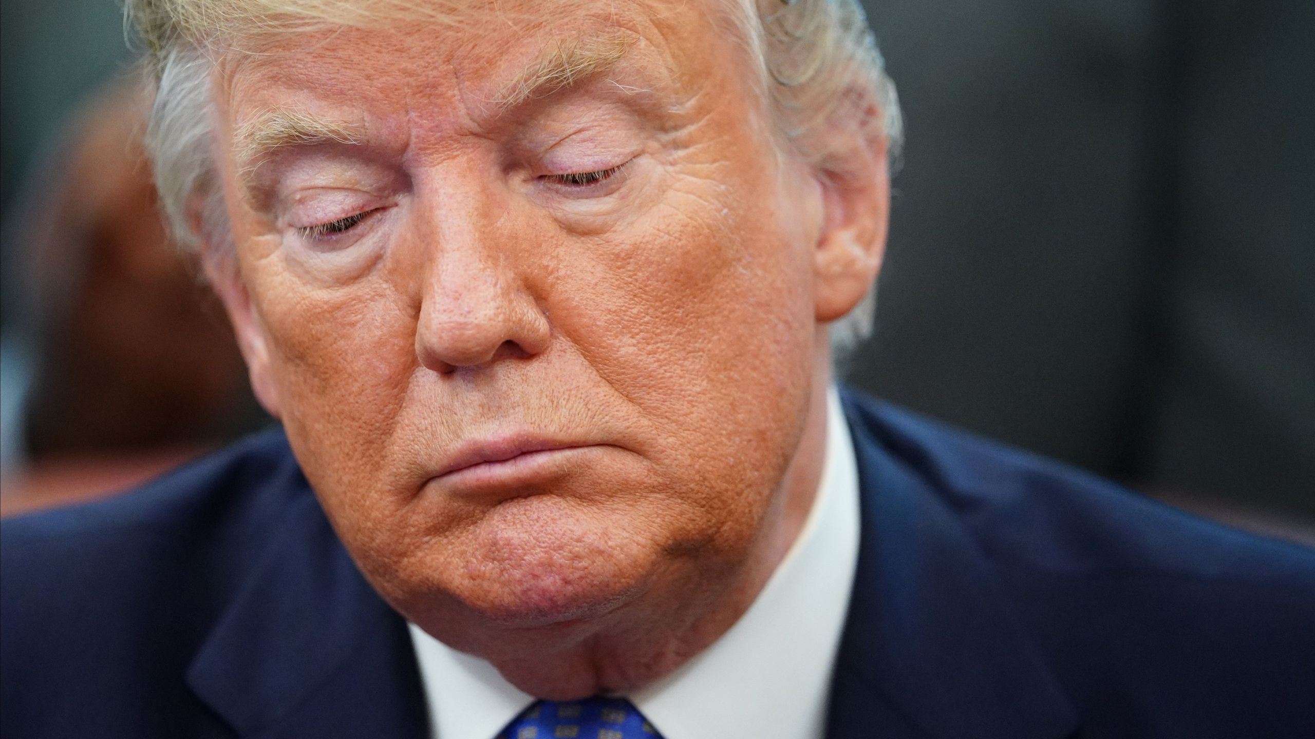 Donald Trump signs an executive order to establish a White House council on affordable housing in the Oval Office of the White House in Washington, DC on June 25, 2019. (Credit: MANDEL NGAN/AFP/Getty Images)