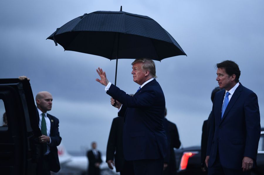 US President Donald Trump gestures as he arrives at Osaka International Airport in Itami, Hyogo prefecture, on June 27, 2019 ahead of the G20 Osaka Summit. (Credit: BRENDAN SMIALOWSKI/AFP/Getty Images)