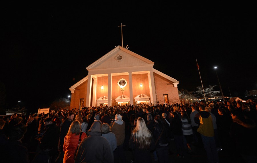 People gather for a prayer vigil at St. Rose Church following the shooting at Sandy Hook Elementary School that killed 26 people, including 20 children, in Newtown, Conn., Dec. 14, 2012. (Credit: EMMANUEL DUNAND/AFP/Getty Images)