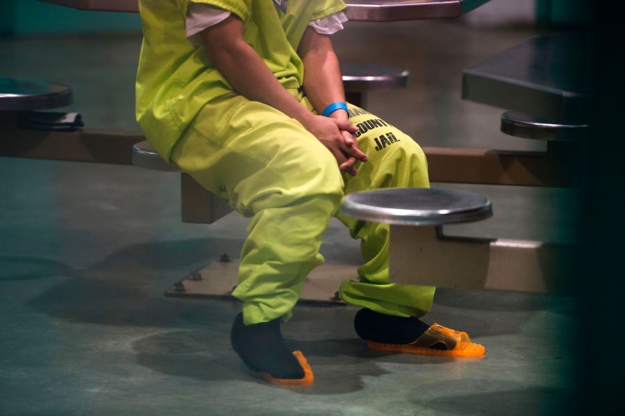 An immigration detainee sits in a high security unit at the Theo Lacy Facility, a county jail that also houses immigration detainees arrested by U.S. Immigration and Customs Enforcement, March 14, 2017 in Orange, California. (Credit: ROBYN BECK/AFP/Getty Images)