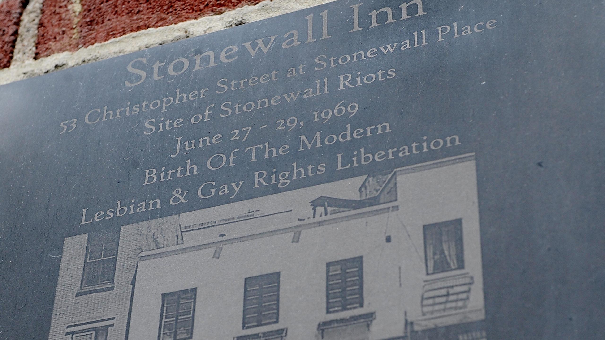 A plaque marks the site of the Stonewall riots at the Stonewall Inn in New York City on June 23, 2009. (Credit: STAN HONDA/AFP/Getty Images)