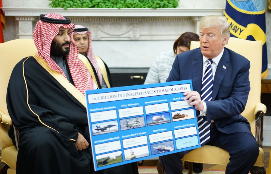 President Donald Trump holds a defense sales chart with Saudi Arabia's Crown Prince Mohammed bin Salman in the Oval Office of the White House on March 20, 2018 in Washington, DC. (Credit: MANDEL NGAN/AFP/Getty Images)