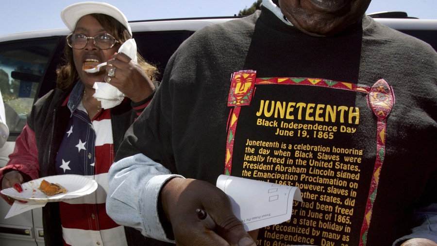 Naomi Williams (L) and D'Emanuel Grosse Sr. (R) taste the sweet potato pie entered in the cook-off contest at the Juneteenth, Black Independence Day celebrations at Nichol Park on June 19, 2004, in Richmond, Calif. (Credit: David Paul Morris/Getty Images)