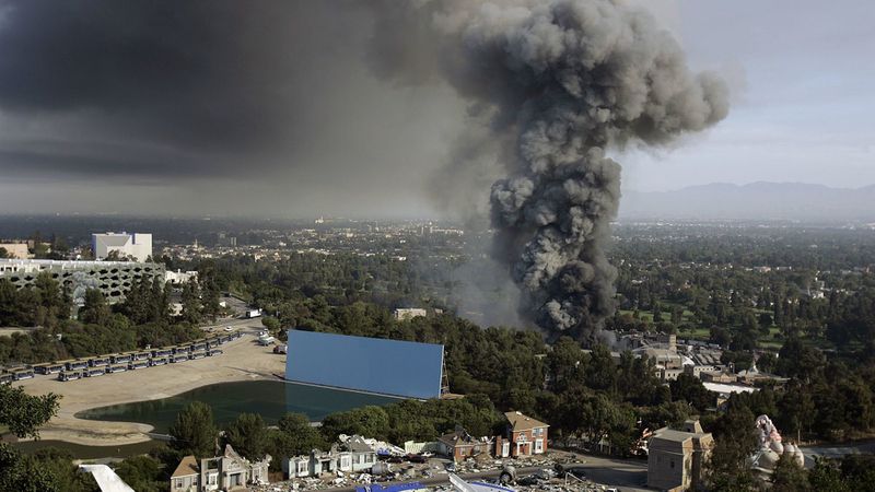 A thick plume of smoke rises from a fire at Universal Studios Hollywood on June 1, 2008. The blaze destroyed several original master recordings held inside a storage facility, which were made by some of the biggest names in music. (Credit: Gary Friedman / Los Angeles Times)