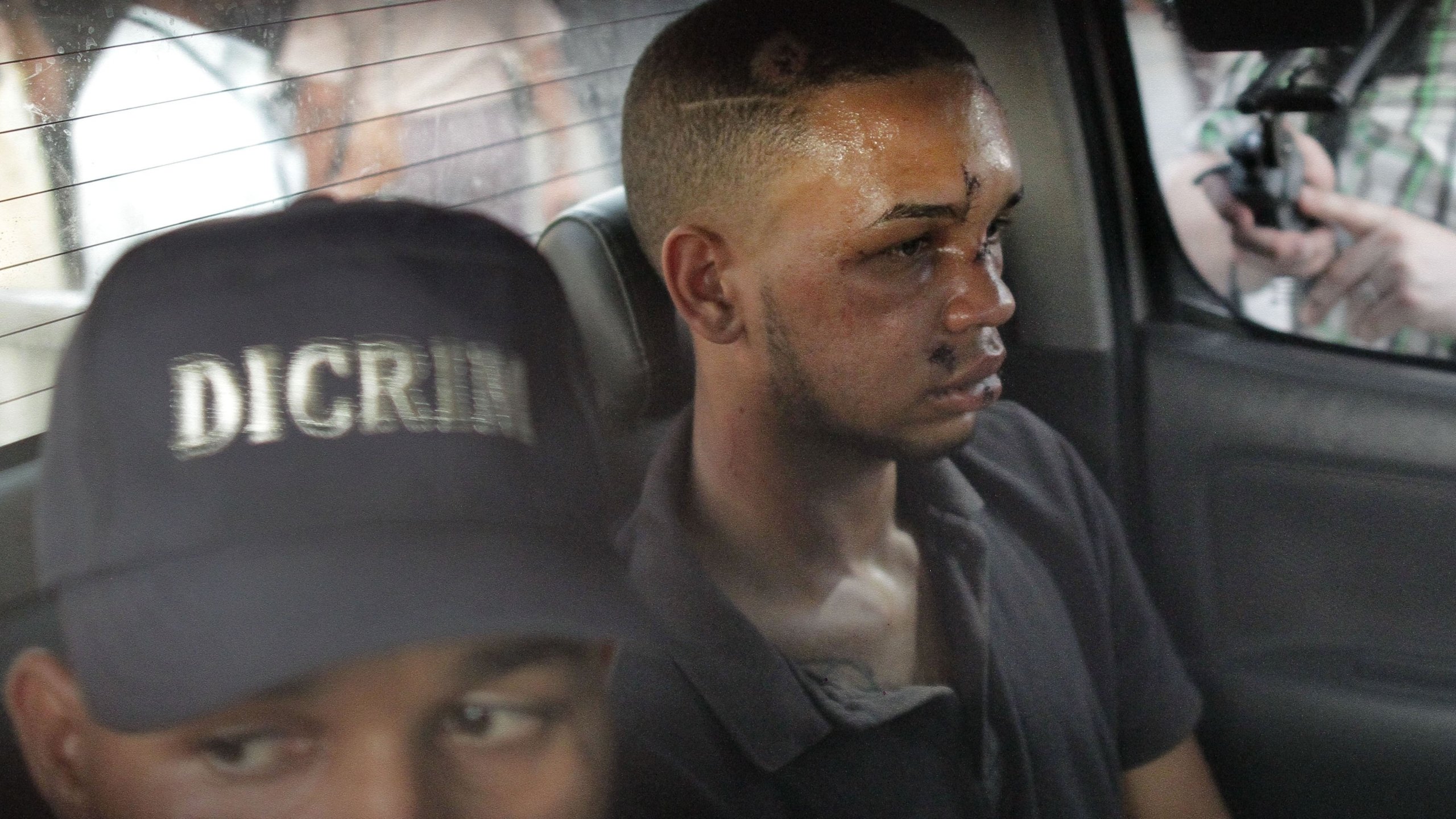 Eddy Vladimir Féliz Garcia, in custody in connection with the shooting of former Boston Red Sox slugger David Ortiz, is transferred by police to court. (Credit: Roberto Guzman/AP)