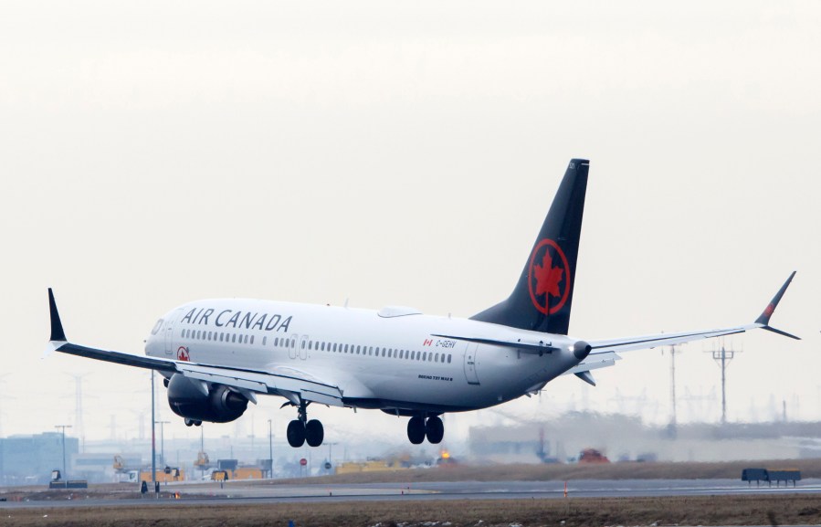 An Air Canada Boeing 737 MAX 8 jet approaches the Toronto Pearson International Airport for a landing on March 13, 2019, in Toronto, Canada. (Credit: Cole Burston/Getty Images)