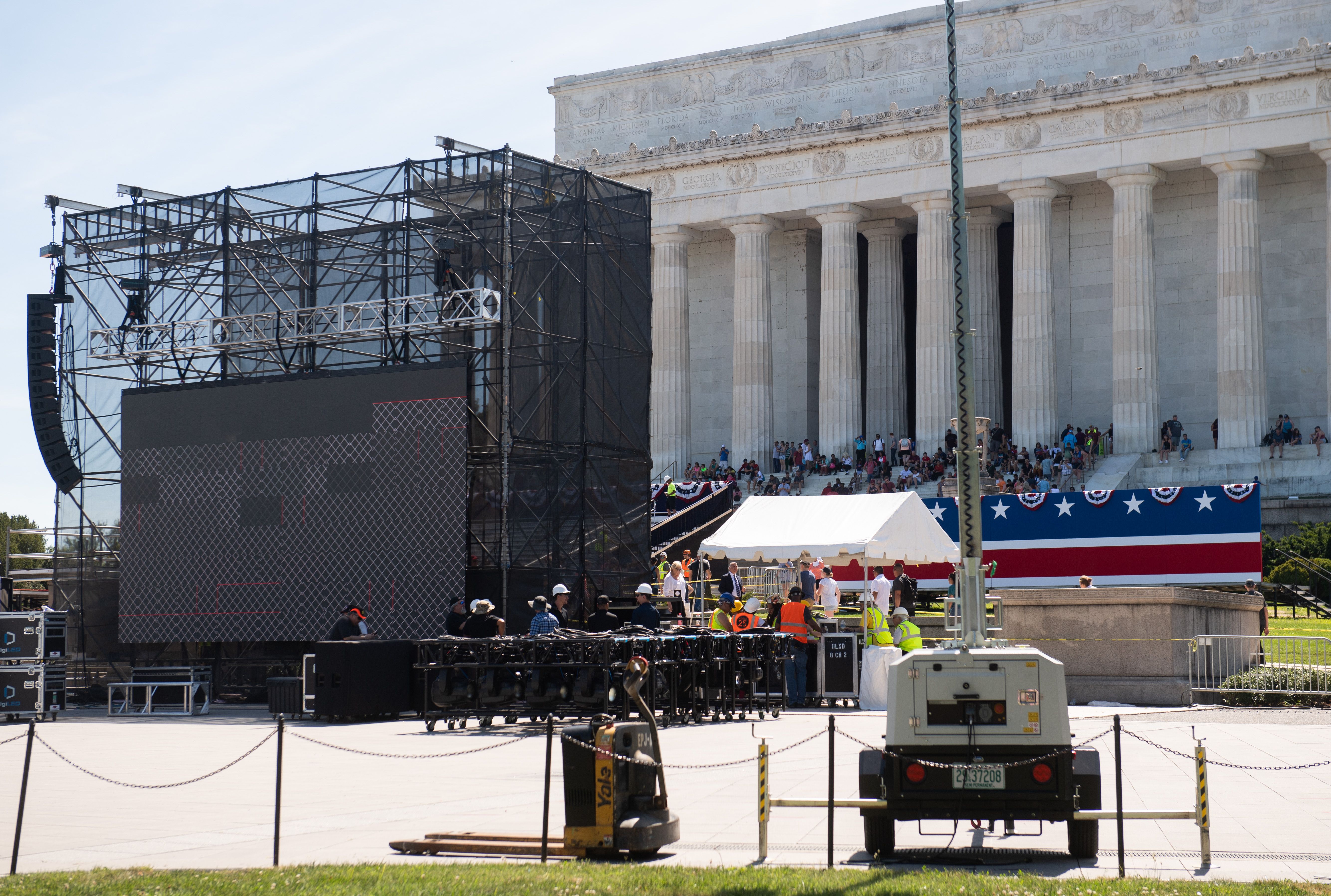 Workers build a stage and bleachers for the "Salute to America" Fourth of July event with Donald Trump at the Lincoln Memorial on the National Mall in Washington, D.C., on July 1, 2019. (Credit: Saul Loeb/AFP/Getty Images)