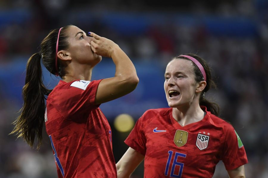 United States' forward Alex Morgan, left, celebrates after scoring a goal during the France 2019 Women's World Cup semi-final football match between England and USA, on July 2, 2019, at the Lyon Satdium in Decines-Charpieu, central-eastern France. (Credit: PHILIPPE DESMAZES/AFP/Getty Images)