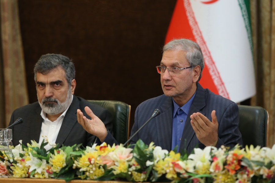 A handout picture provided by the Iranian presidency on July 7, 2019 shows (left to right) Iran's Atomic Energy Organization spokesman Behrouz Kamalvandi and government spokesman Ali Rabiei giving a joint press conference at the presidential headquarters in Tehran. (Credit: AFP/Getty Images)