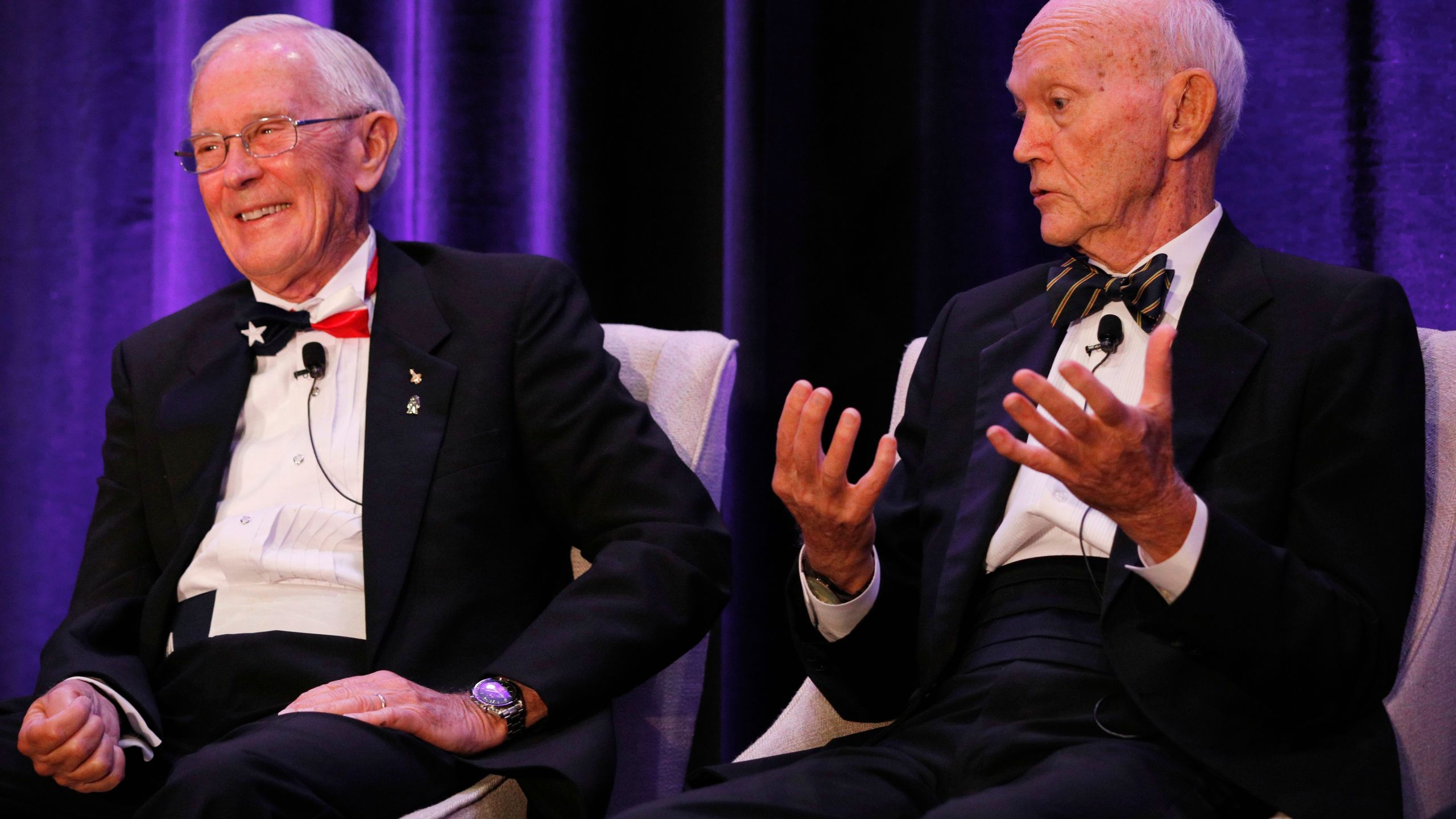 Apollo 16 astronaut Charlie Duke, left, reacts to a remark from Apollo 11 astronaut Michael Collins during the "Legends of Apollo" media event in Cocoa Beach, Florida on July 16, 2019. (Credit: Gregg Newton / AFP / Getty Images)