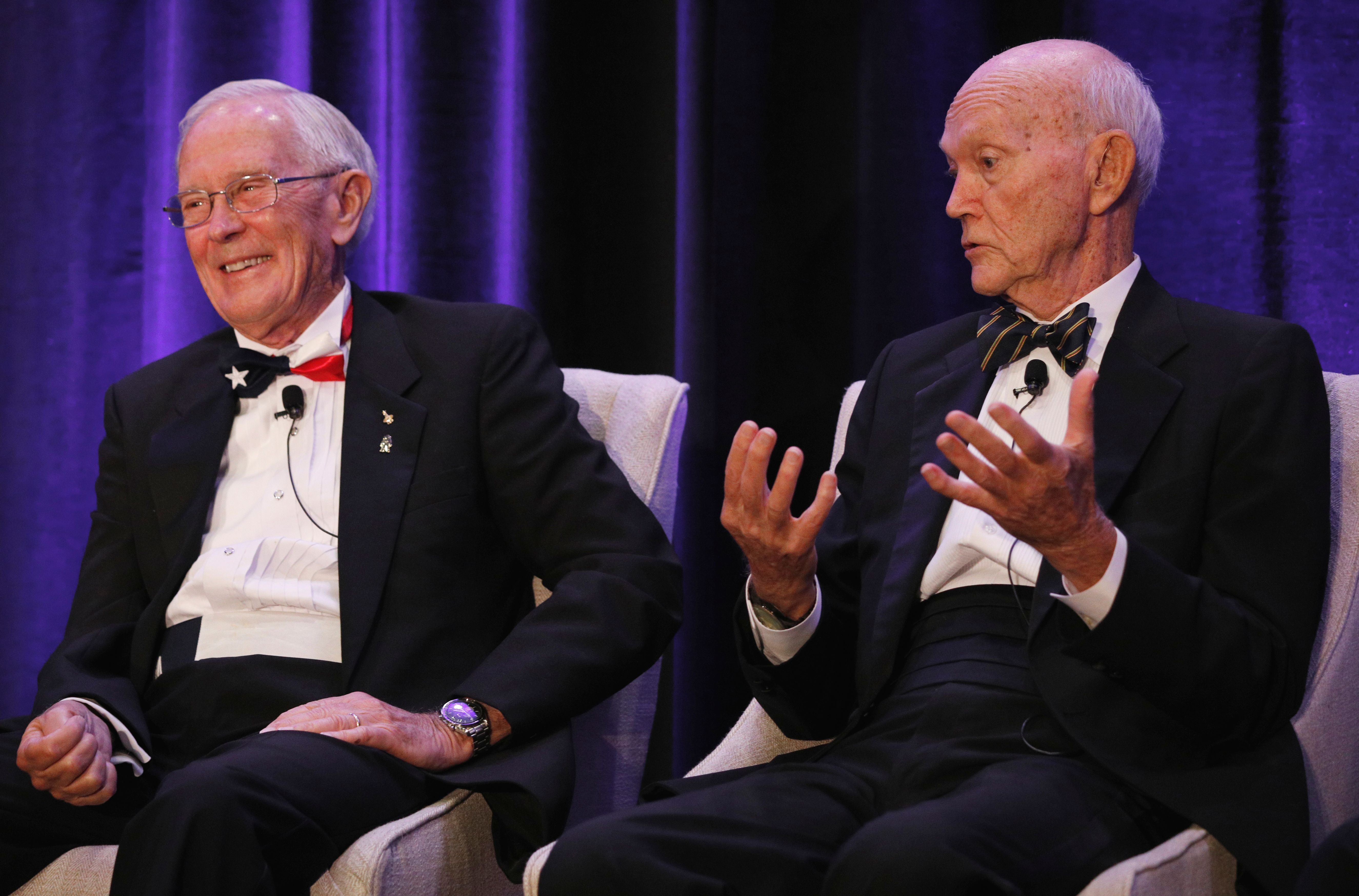 Apollo 16 astronaut Charlie Duke, left, reacts to a remark from Apollo 11 astronaut Michael Collins during the "Legends of Apollo" media event in Cocoa Beach, Florida on July 16, 2019. (Credit: Gregg Newton / AFP / Getty Images)