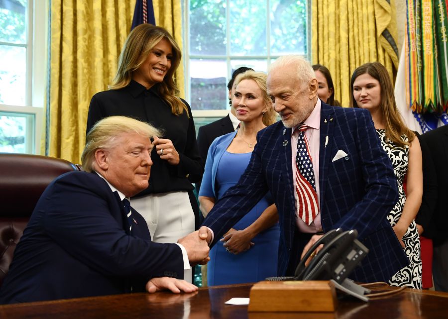 U.S. President Donald Trump shakes hands with Apollo 11 crew member Buzz Aldrin on July 19, 2019, at the White House in Washington, D.C., during a ceremony commemorating the 50th anniversary of the Moon landing. (Credit: Brendan Smialowski / AFP/ Getty Images)