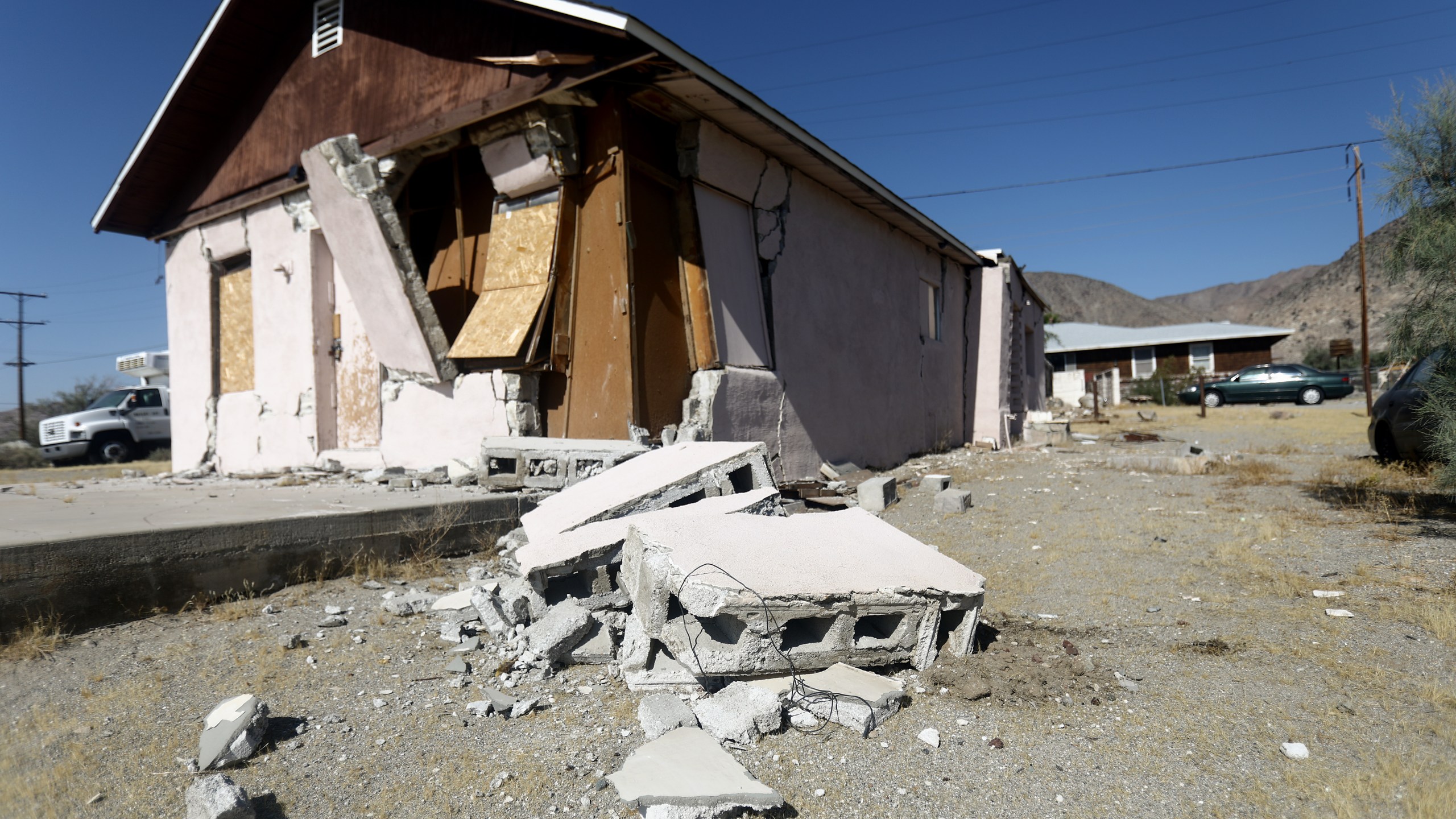 A house is damaged after a 7.1 magnitude earthquake struck in the area on July 6, 2019 in Trona, Calif. (Credit: Mario Tama/Getty Images)