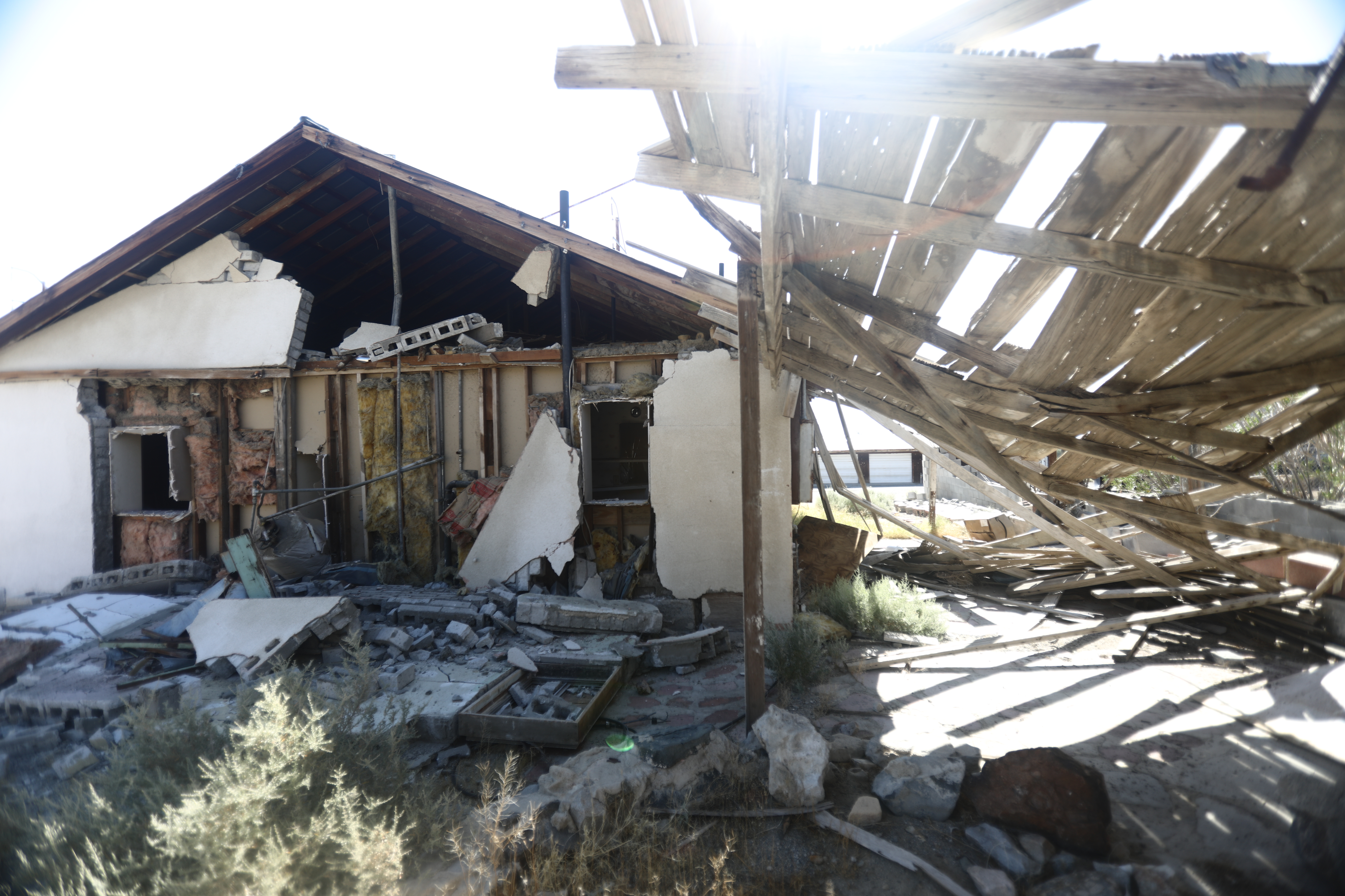 A house is damaged after a 7.1 magnitude earthquake struck in the area on July 6, 2019, in Trona, Calif. (Credit: Mario Tama/Getty Images)