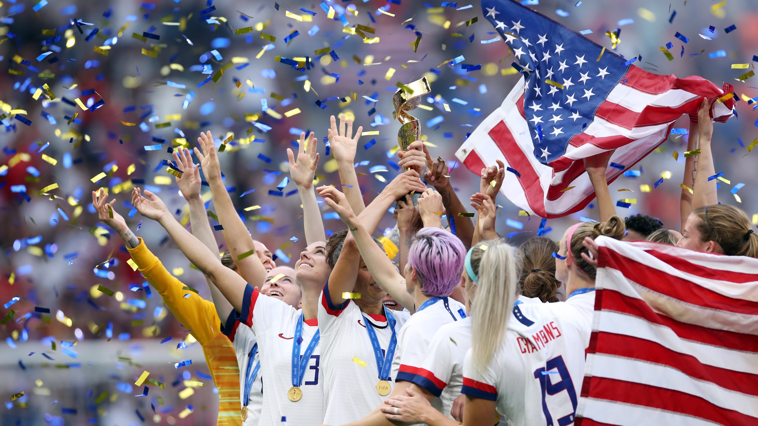 The U.S. women's national team celebrates with the trophy following victory in the 2019 FIFA Women's World Cup France Final match against the Netherlands at Stade de Lyon on July 7, 2019 in Lyon, France. (Credit: Alex Grimm/Getty Images)