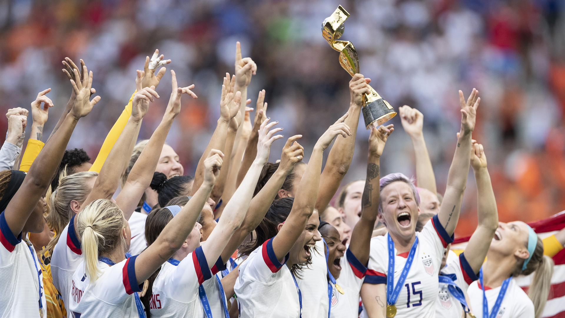 The U.S. Women's National Team celebrates with the FIFA Women's World Cup Trophy following team's victory in the 2019 FIFA Women's World Cup France Final match between The United States of America and The Netherlands at Stade de Lyon on July 07, 2019 in Lyon, France. (Credit: Maja Hitij/Getty Images)