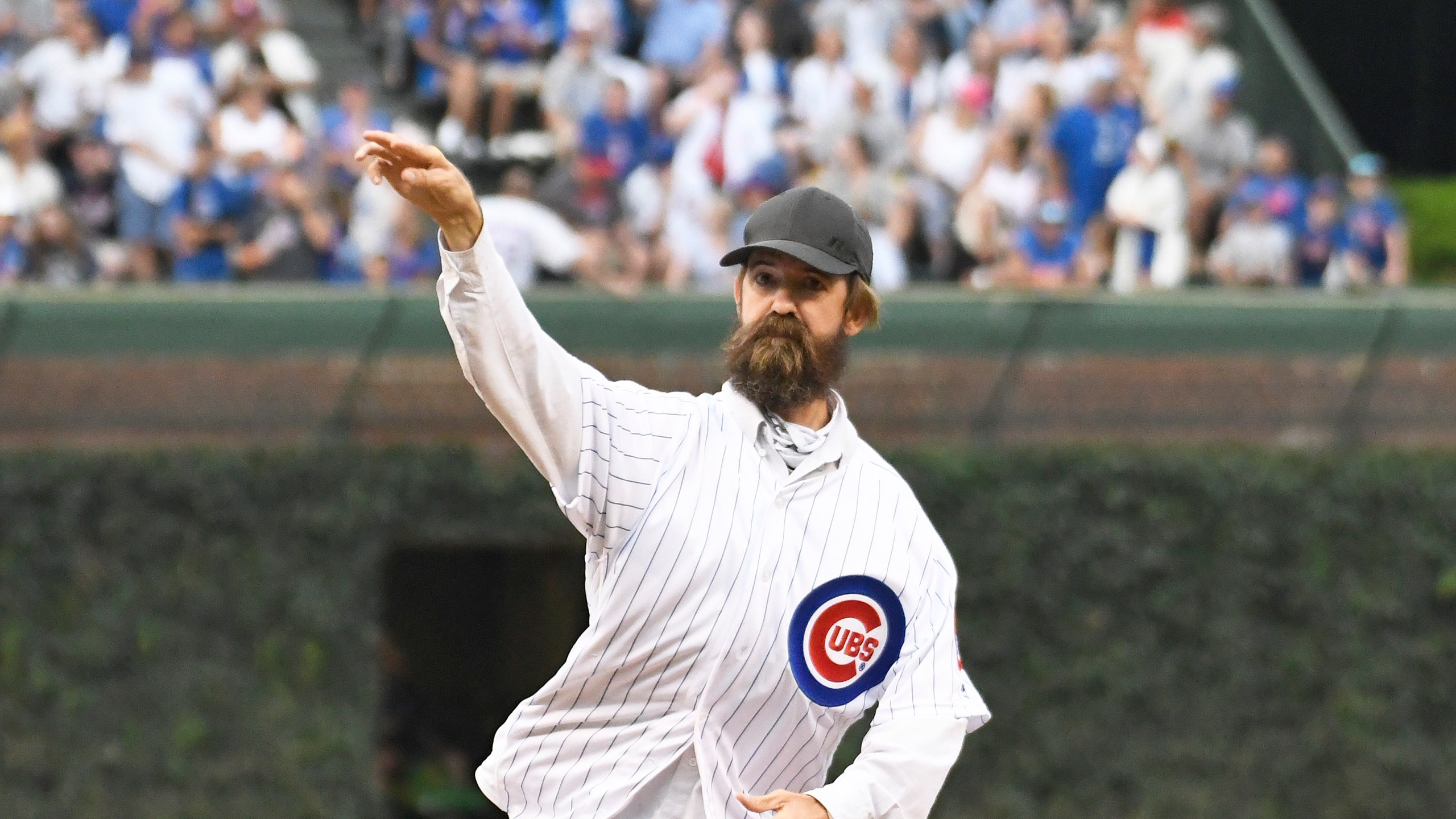 Alligator expert and trapper Frank Robb throws out a ceremonial first pitch before the game between the Chicago Cubs and the Cincinnati Reds at Wrigley Field on July 16, 2019. (Credit: David Banks/Getty Images)