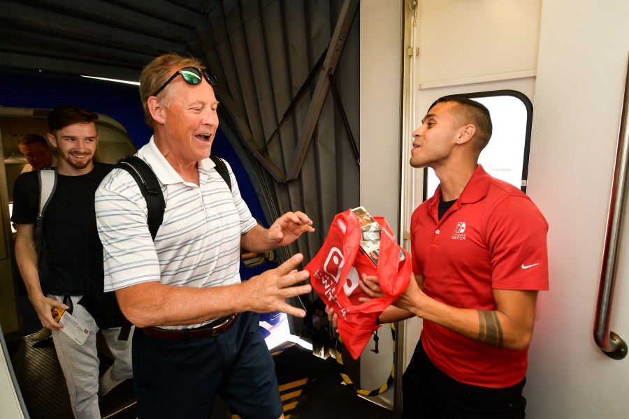 Southwest Airlines passengers are surprised with their own Nintendo Switch system at San Diego International Airport on July 17, 2019. (Credit: Matt Winkelmeyer/Getty Images for Nintendo)