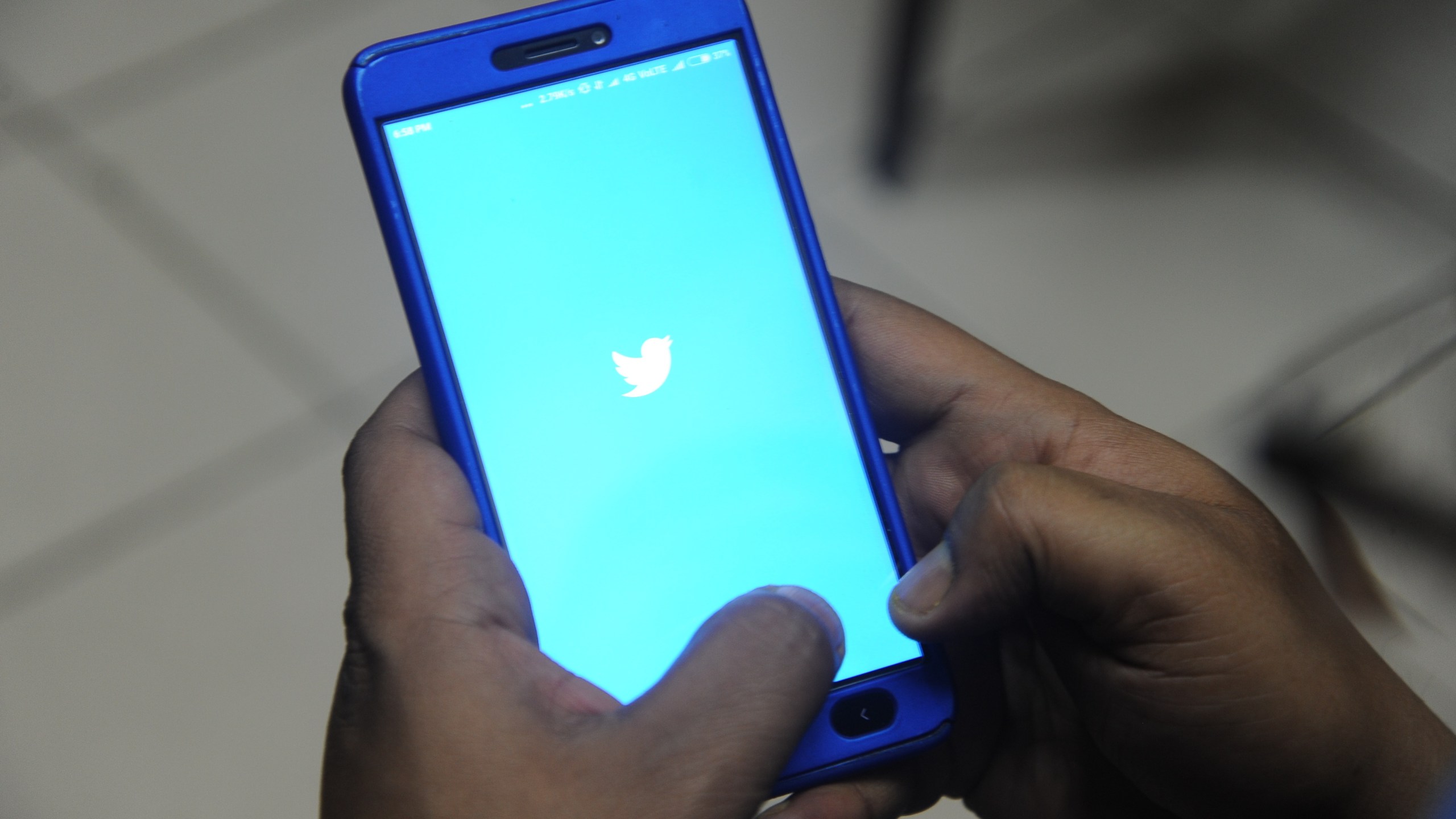 The logo of social networking website Twitter is displayed on a cellphone screen in a file photo. (Credit: DIPTENDU DUTTA/AFP/Getty Images)