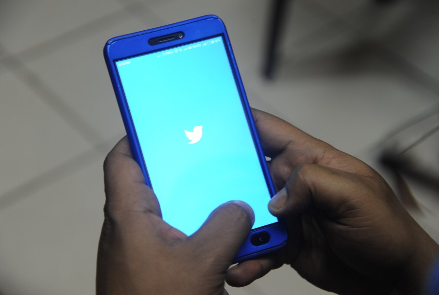 The logo of social networking website Twitter is displayed on a cellphone screen in a file photo. (Credit: DIPTENDU DUTTA/AFP/Getty Images)