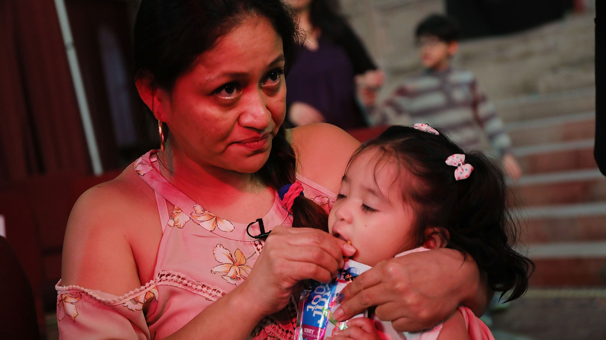 Aura Hernandez, a 37-year-old woman from Guatemala taking sanctuary in a Manhattan church, holds her 15-month-old daughter during a vigil on March 29, 2018. (Credit: Spencer Platt / Getty Images)