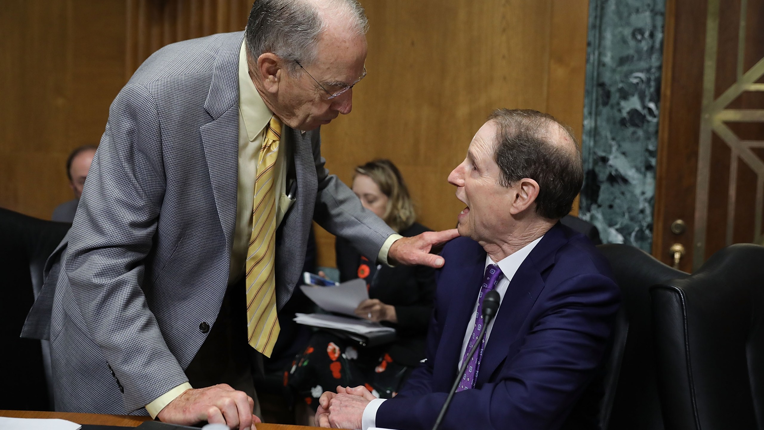 Senate Finance Committee member Sen. Charles Grassley (R-IA) (L) talks with committee ranking member Sen. Ron Wyden (D-OR) before a hearing with U.S. Secretary of Commerce Wilbur Ross in the Dirksen Senate Office Building on Capitol Hill June 20, 2018 in Washington, DC. (Credit: Chip Somodevilla/Getty Images)