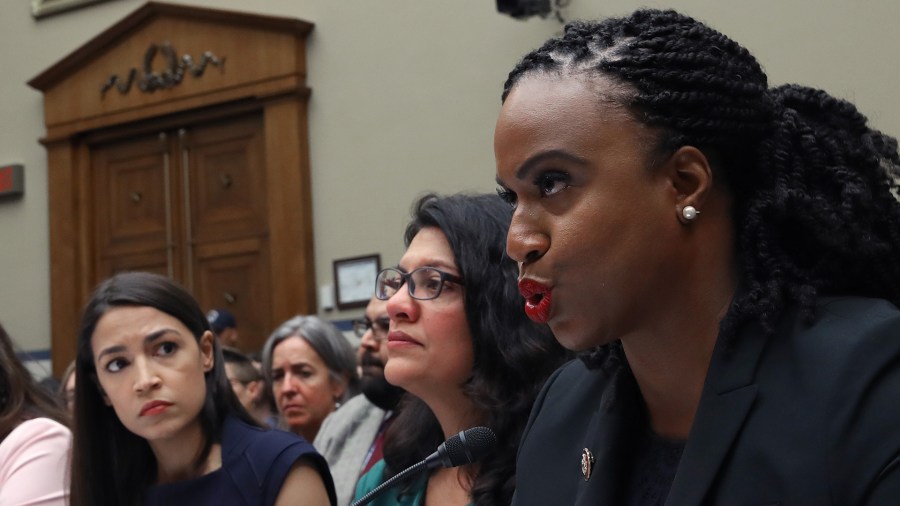 From right: Rep. Ayanna S. Pressley (D-MA) (right) testifies before a House Oversight and Reform Committee hearing on "The Trump Administration's Child Separation Policy: Substantiated Allegations of Mistreatment" with (from left to right) Rep. Alexandria Ocasio-Cortez (D-NY) and U.S. Rep. Rashida Tlaib, (D-MI), on July 12, 2019, in Washington, D.C. (Credit: Win McNamee/Getty Images)