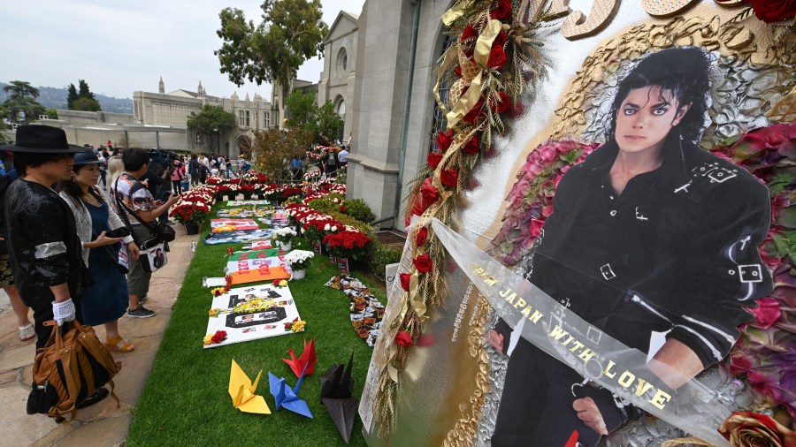 Fans visit Michael Jackson's mausoleum at Forest Lawn Cemetery in Glendale, California on June 25, 2019, the 10th anniversary of the King of Pop's death. (Credit: Robyn Beck/AFP/Getty Images)