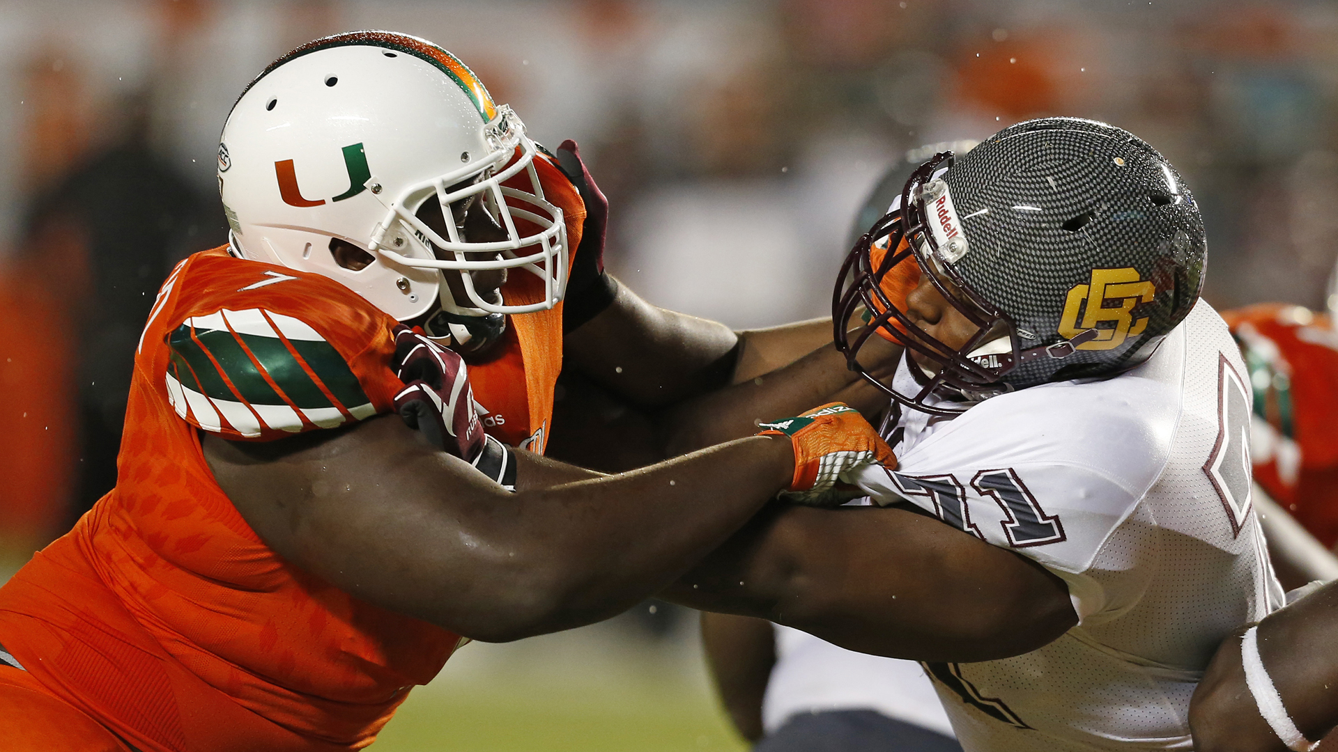 Kendrick Norton of the Miami Hurricanes, left, battles Phillip Norman of the Bethune-Cookman Wildcats during third quarter action on September 5, 2015 at Sun Life Stadium in Miami Gardens, Florida. (Credit: Joel Auerbach/Getty Images)