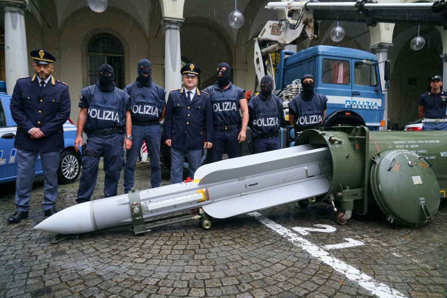 Italian police have seized "an arsenal of military weapons," including an air-to-air missile, and Nazi paraphernalia from three men, one a former political candidate for an extreme right party. (Credit: Tino Romano/AP)