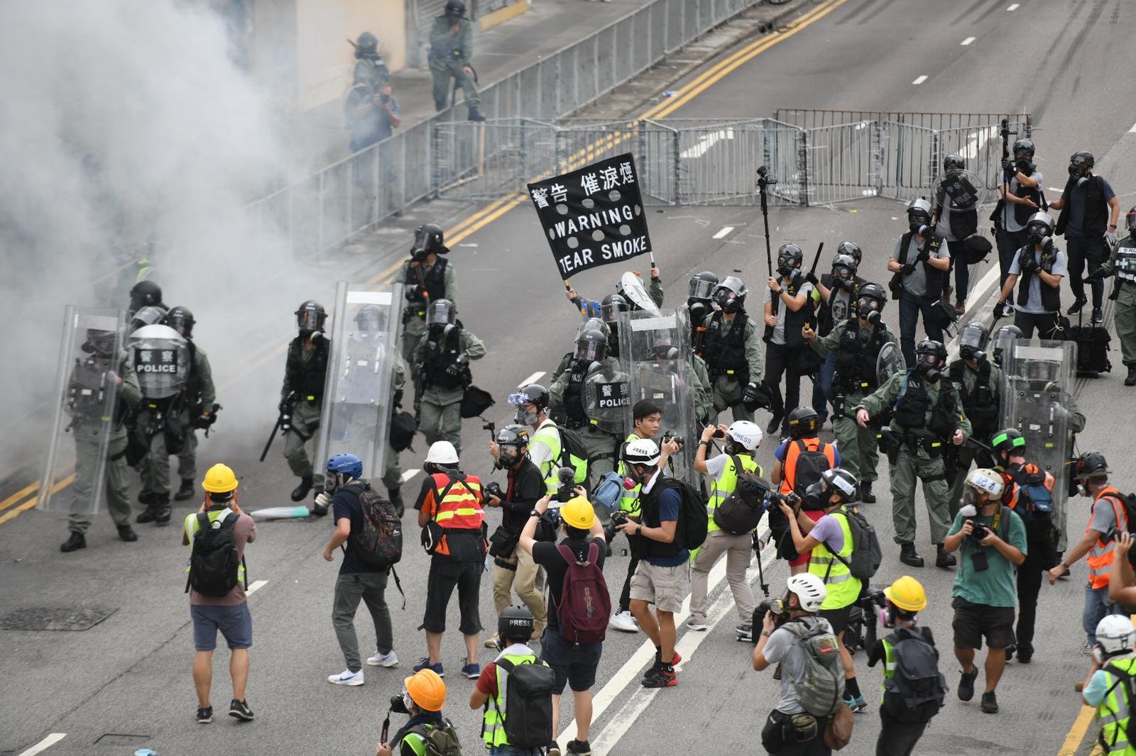 Riot police and protesters have become locked in a tense standoff in the small town of Yuen Long, near Hong Kong's border with China, after tens of thousands took to the streets for the eighth consecutive weekend. (Credit: CNN)