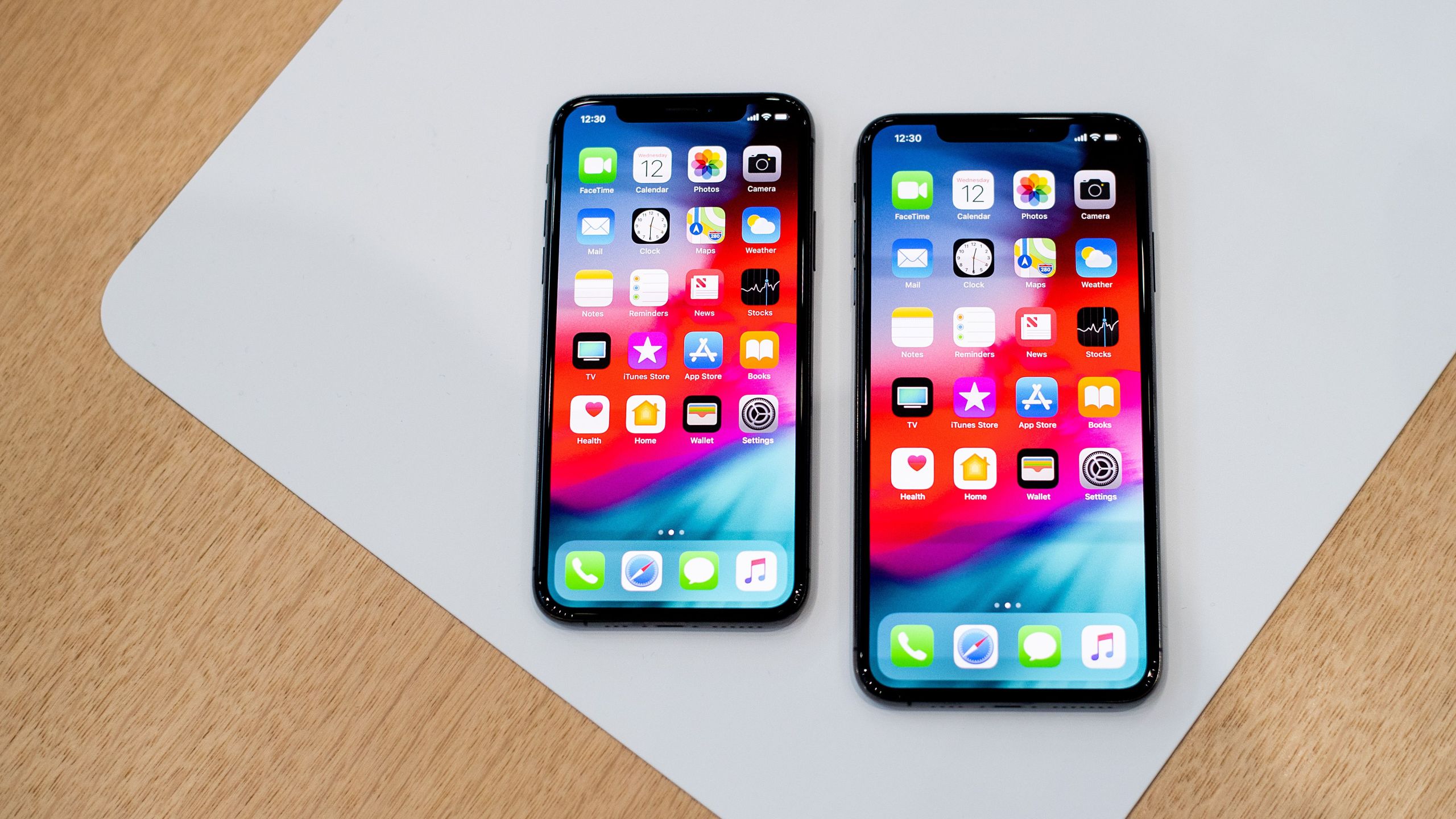 An Apple iPhone Xs Max and iPhone Xs rest on a table during a launch event on Sept. 12, 2018, in Cupertino, California.(Credit: Noah Berger/AFP/Getty Images)