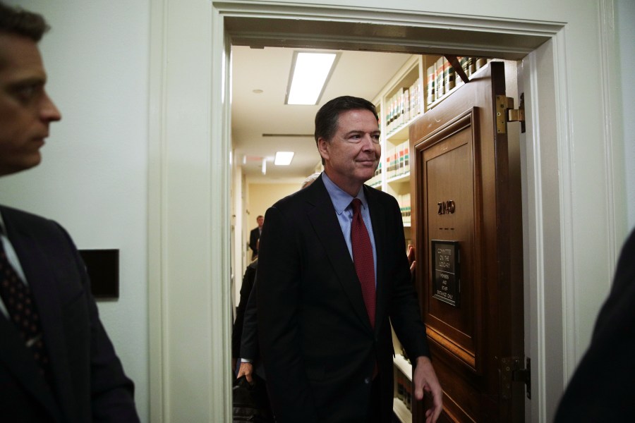 James Comey comes out of the hearing room at the Rayburn House Office Building after testifying to the House Judiciary and Oversight and Government Reform committees on Capitol Hill Dec. 7, 2018 in Washington, D.C. (Credit: Alex Wong/Getty Images)