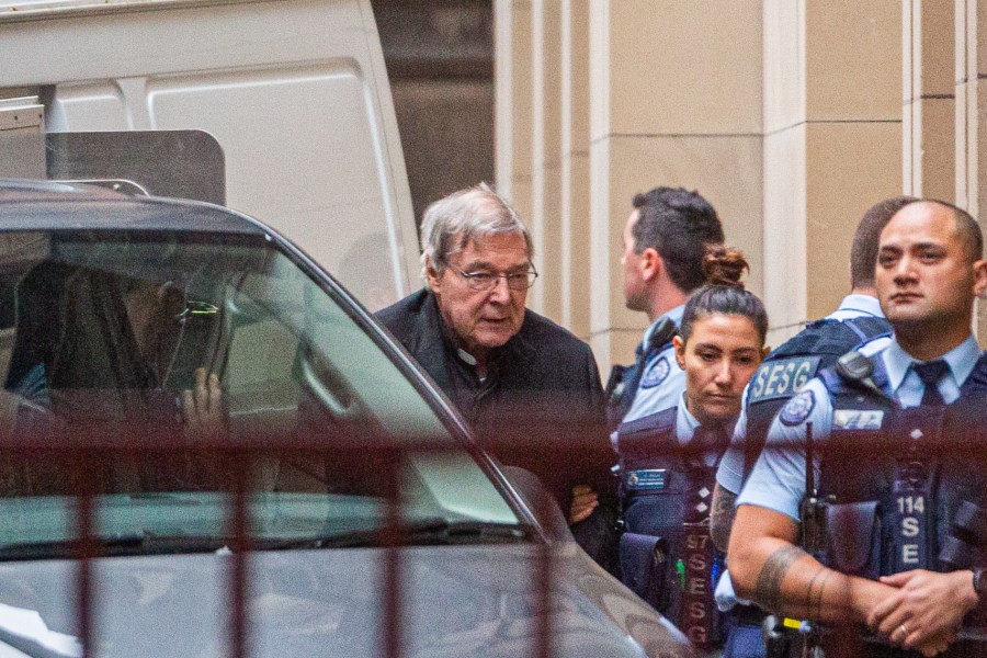 Australian Cardinal George Pell is escorted into the Supreme Court of Victoria in Melbourne on June 6, 2019. (Credit: ASANKA BRENDON RATNAYAKE/AFP/Getty Images)