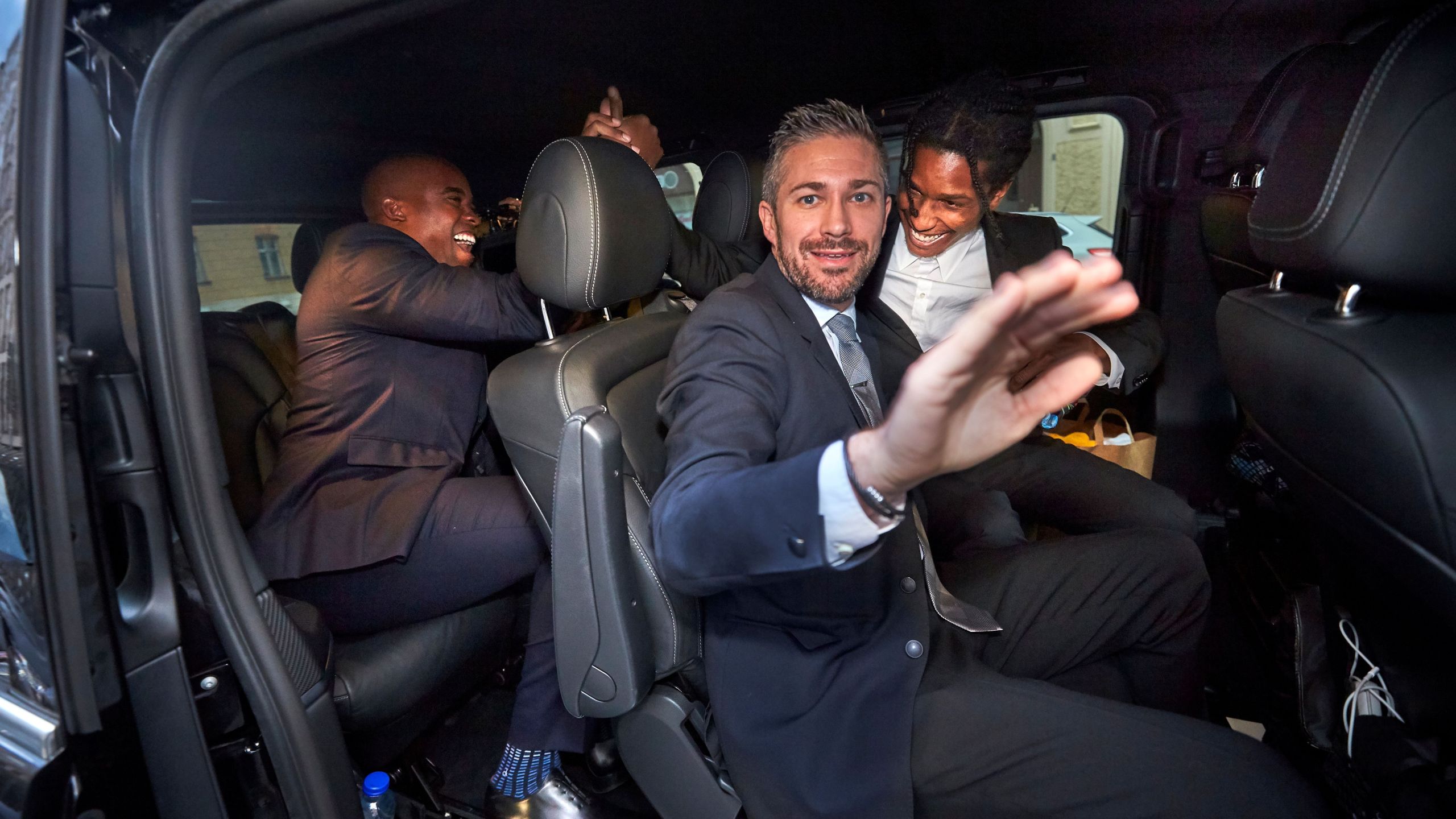 Rapper A$AP Rocky, on the right, leaves the district court after being told he will be released from custody on Aug. 2, 2019, in Stockholm. (Credit: Fredrik Persson/AFP/Getty Images)