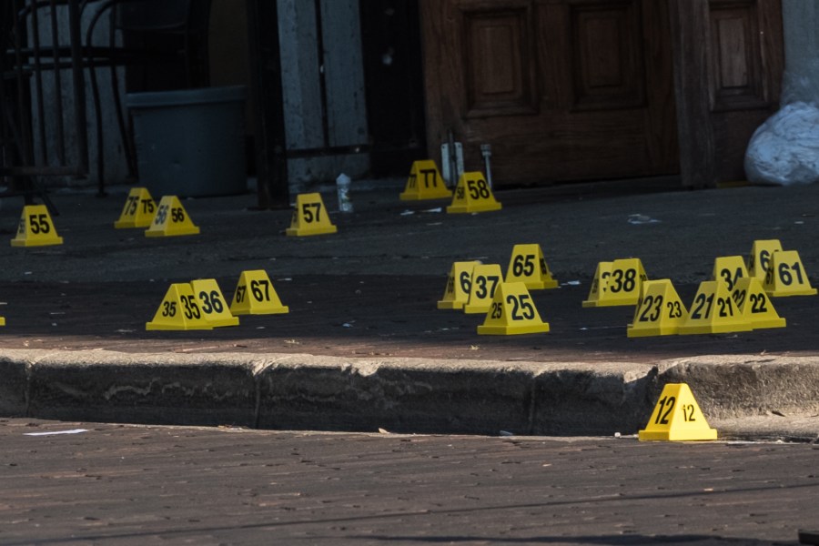 Police mark evidence after an active shooter opened fire in the Oregon district in Dayton, Ohio on August 4, 2019.(Credit: MEGAN JELINGER/AFP/Getty Images)