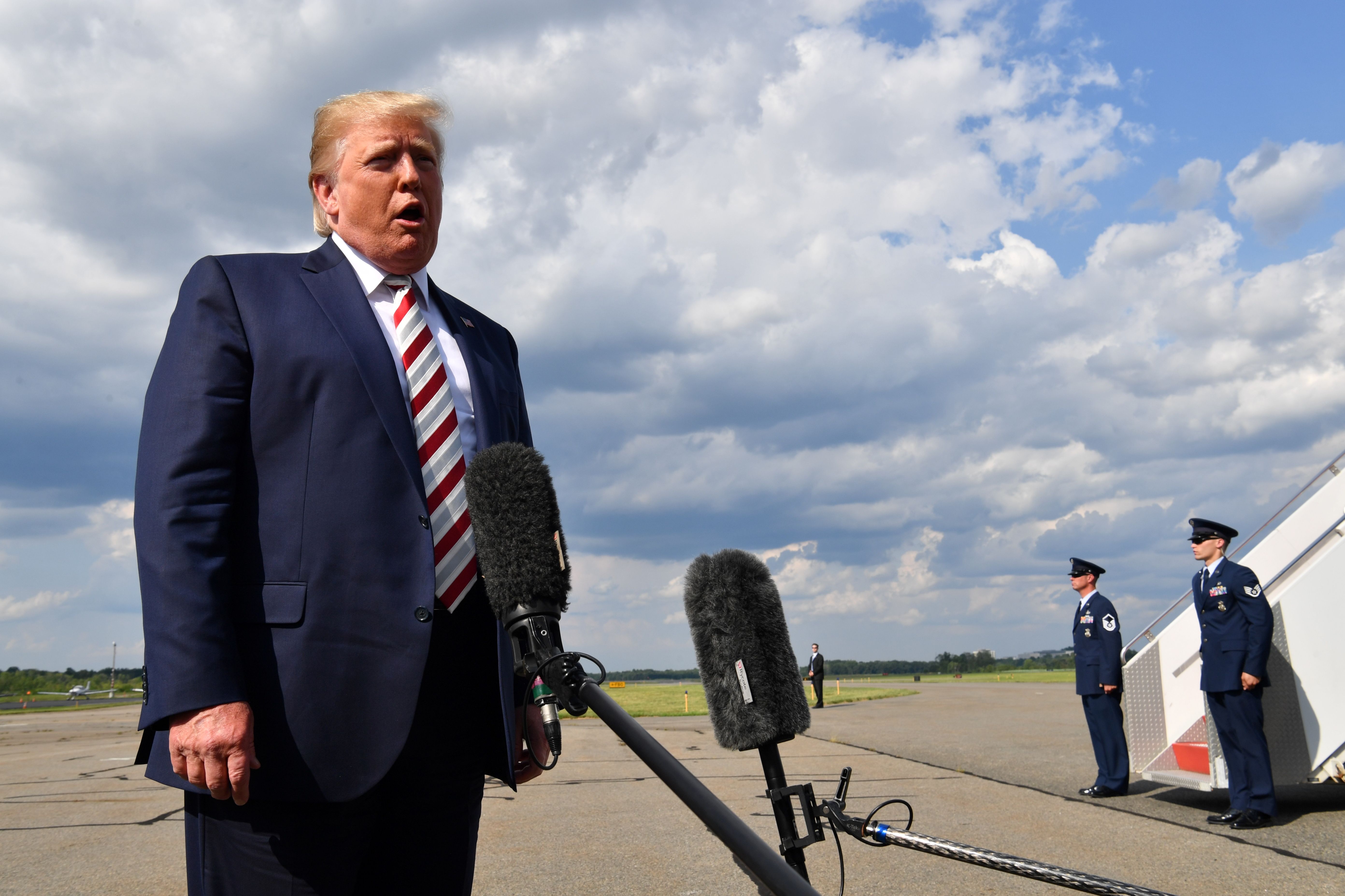 US President Donald Trump gives a statement about the recent mass shootings in El Paso and Dayton before boarding to Washington at Morristown Airport on August 04, 2019. (Credit: NICHOLAS KAMM/AFP/Getty Images)