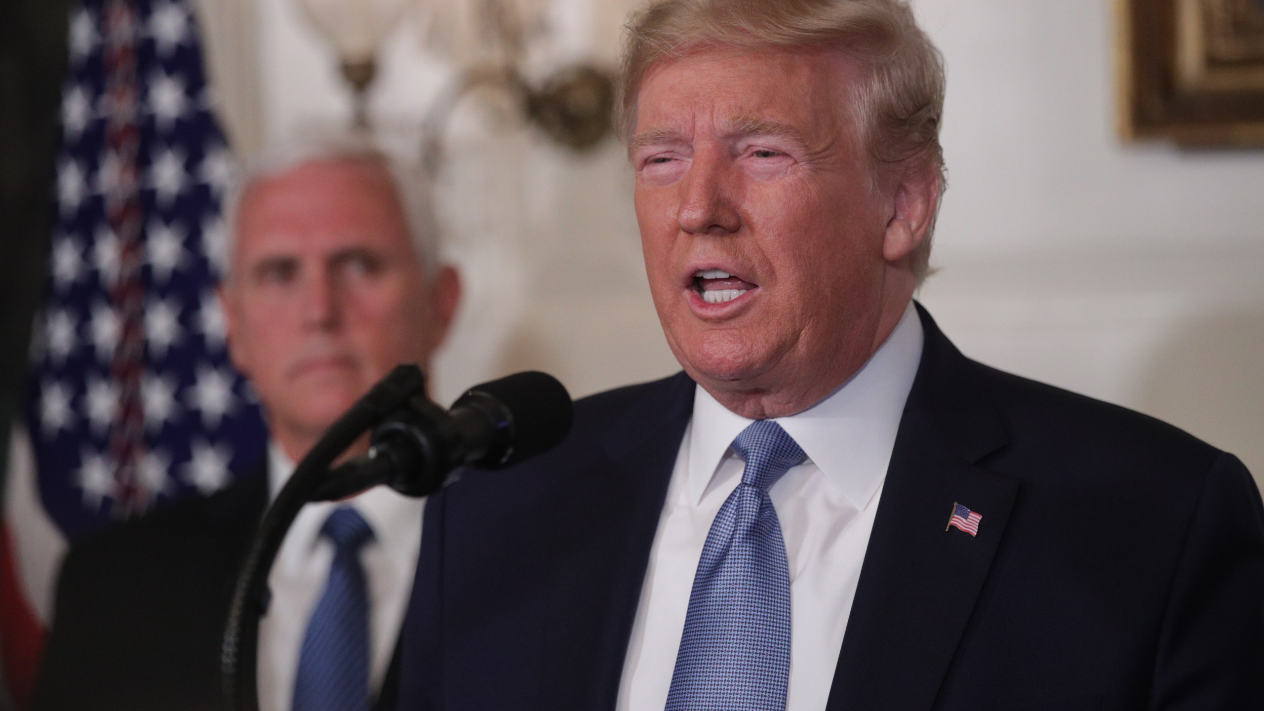 U.S. President Donald Trump makes remarks in the Diplomatic Reception Room of the White House as Vice President Mike Pence looks on Aug. 5, 2019, in Washington, D.C. (Credit: Alex Wong/Getty Images)