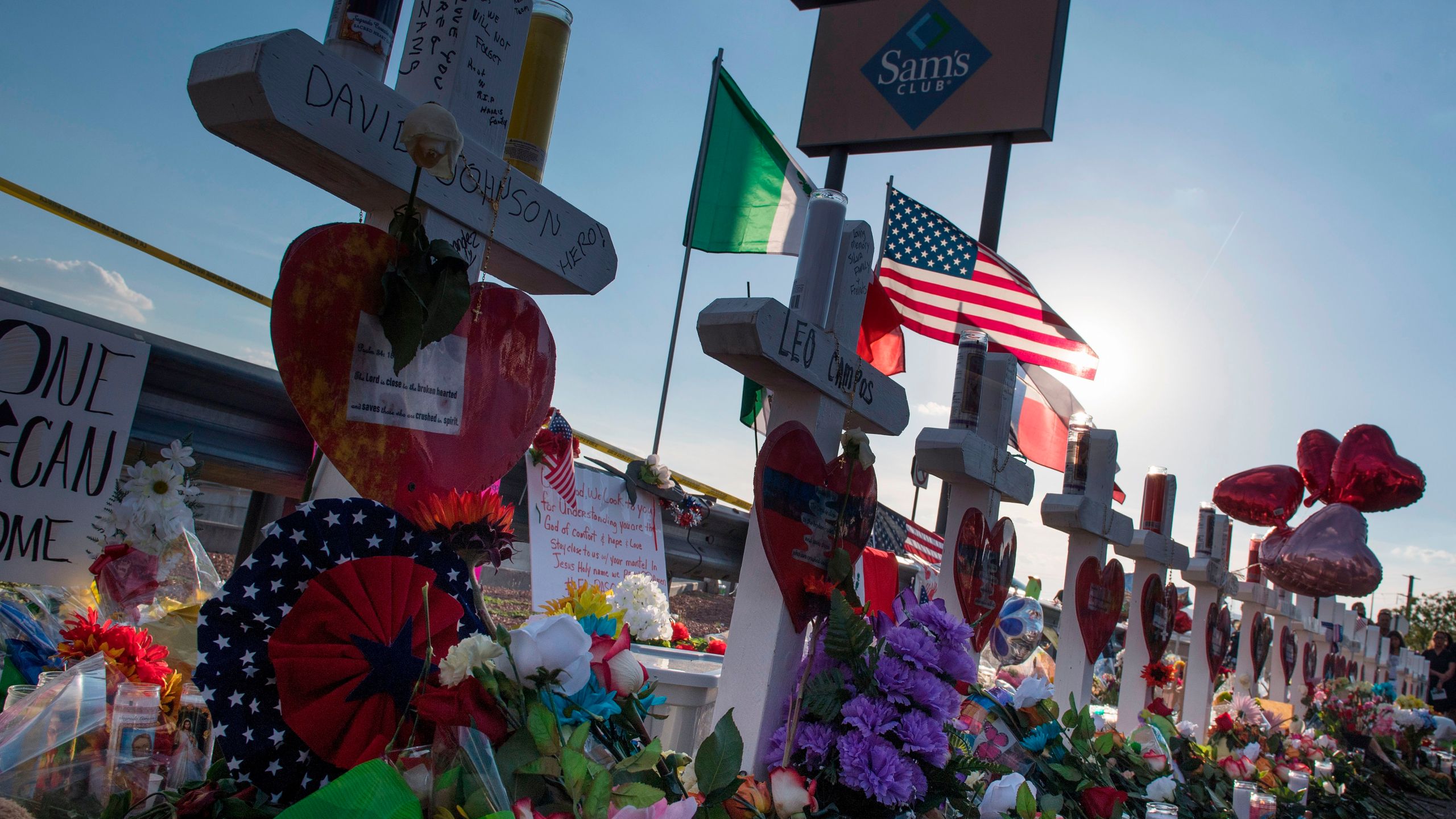 Crosses and flowers at a makeshift memorial for victims of Walmart shooting that left a total of 22 people dead at the Cielo Vista Mall WalMart in El Paso, Texas, on August 5, 2019. (Credit: MARK RALSTON/AFP/Getty Images)